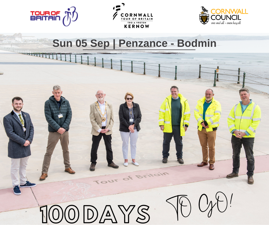 Group photograph of Deputy Mayor of Penzance, Councillor Will Elliott; Cornwall Councillor for Penzance Promenade Jim McKenna; Mayor of Penzance Councillor Jonathan How; Leader of Cornwall Council Linda Taylor; Steve Worthington (Cormac); Andy Berryman (Cormac); and Mark Lahera (Cormac) at Penzance Promenade beside the Tour of Britain waymarker