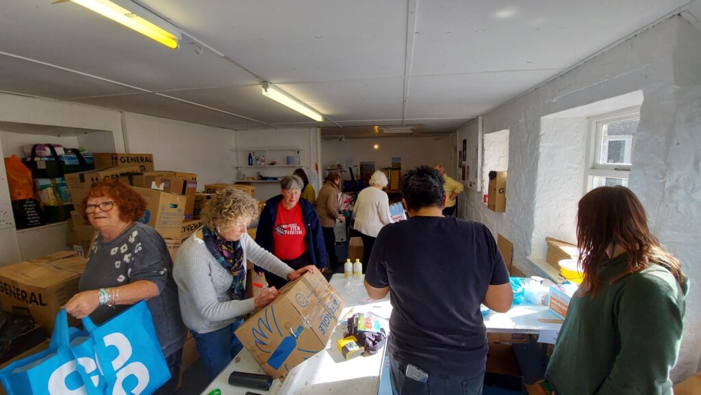 Volunteers helping with donations for Ukrainian Refugees in the Coach House