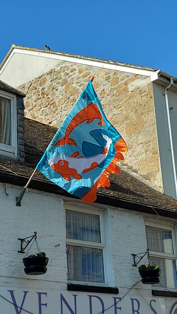 Koi Carp flag (designed by Liz Tyrrell) flying on Alverton Street
