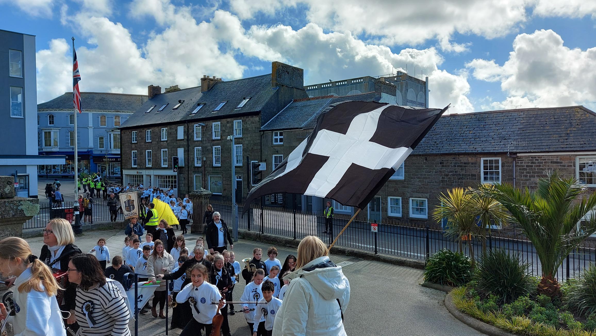 School children entering St John's Hall at the St Piran Furry Dance Penzance, 2022