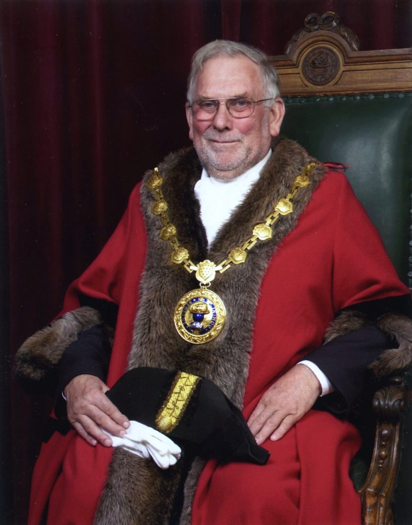 Former Mayor, Cllr Roy Mann, sat on the Mayor's Chair in full civic regalia