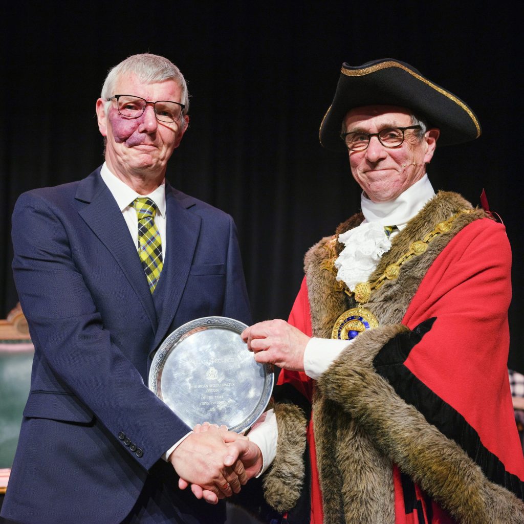 Citizen of the Year 2026, Steve Colenso, receiving his award from outgoing Mayor Cllr Stephen Reynolds