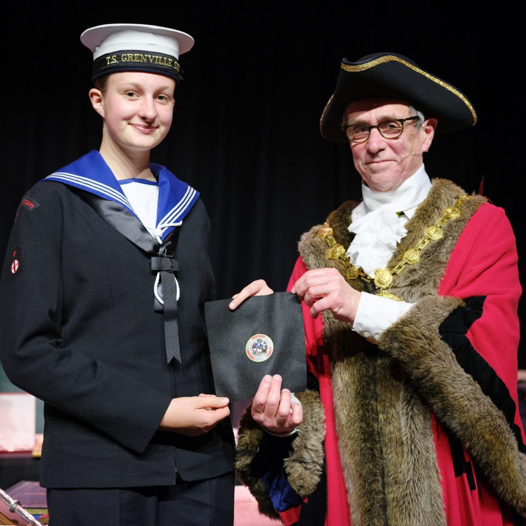 Mayor’s Sea Cadet for 2026/27, Sea Cadet Isabella Nowell, receiving her official badge of office from outgoing Mayor Cllr Stephen Reynolds