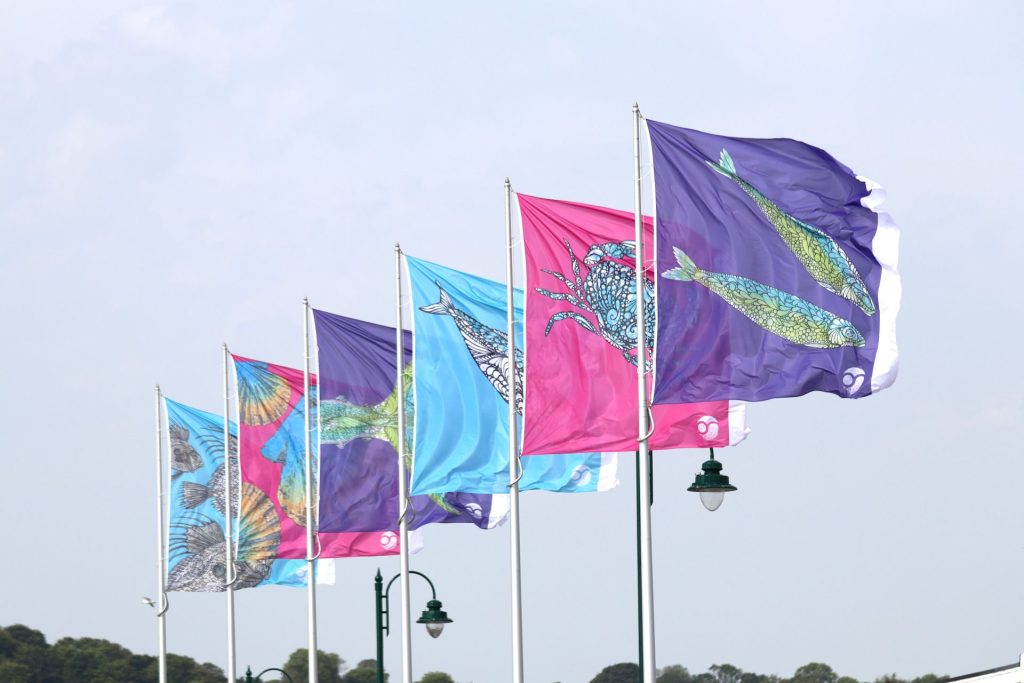 2026 summer flags flying on the prom